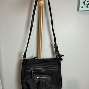 Tutilo New York Elegant Black Handbag with Gold Details